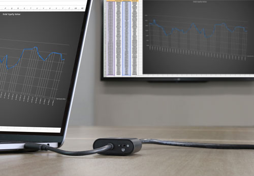 Photo illustrates a laptop computer using the adapter to present